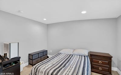 Comfortable guest bedroom with clean finishes, modern flooring, and flexible layout options.