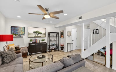 Spacious Scottsdale living room with updated flooring, recessed lighting, and flexible layout ideal for relaxing or hosting guests.