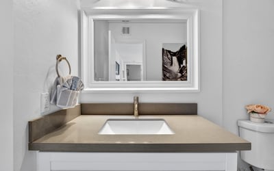 Clean Scottsdale bathroom featuring updated vanity, sleek fixtures, and solid surface counters for a modern, low-maintenance space.