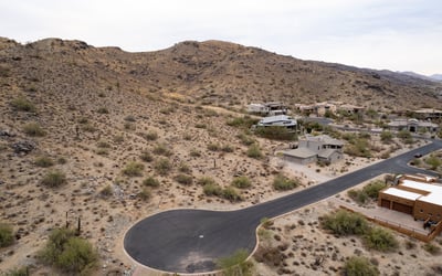 Exceptional hillside lot bordering protected preserve land, offering privacy, scenic desert terrain, and direct access to hiking and biking trails. A rare opportunity to build surrounded by untouched natural beauty.