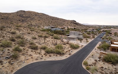 Elevated homesite featuring dramatic mountain backdrops and scenic desert surroundings. Enjoy peaceful hillside living with direct access to nearby hiking trails and outdoor recreation in Phoenix.