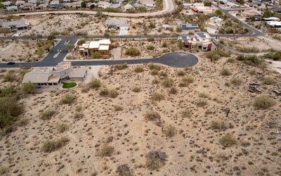 Peaceful hillside neighborhood surrounded by mountain landscapes and upscale custom homes. This elevated Phoenix homesite offers stunning views and a tranquil desert lifestyle.