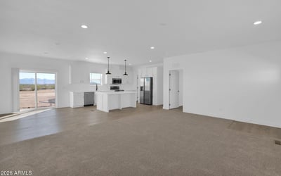 Open-concept great room designed for gathering and entertaining, featuring recessed lighting, expansive living space, and seamless connectivity to the kitchen. The layout creates an airy, welcoming environment filled with natural light.
