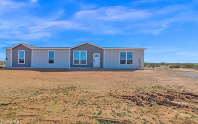 Freshly completed home featuring attractive curb appeal, spacious land, and beautiful mountain views. This Wittmann property offers modern comfort paired with the freedom of rural living.