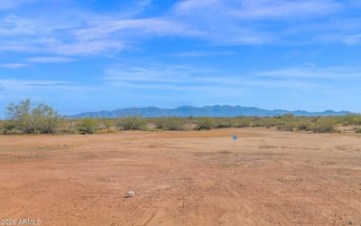 Picturesque mountain vistas stretch across the horizon, creating a beautiful backdrop for this Wittmann property. The expansive lot allows homeowners to enjoy the tranquility and openness of desert living.