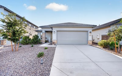 This beautifully maintained home welcomes you with contemporary architecture, a covered front porch, desert landscaping, a spacious driveway, and an attached two-car garage in the desirable Sunrise community of Surprise.