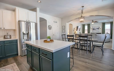 Welcoming front entry featuring upgraded stair flooring, modern finishes, and an open layout that showcases the home's spacious design and thoughtful renovations.