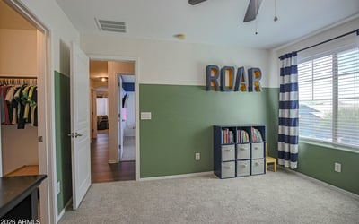 Well-appointed upstairs bathroom featuring an extended vanity, updated lighting, modern fixtures, and a convenient tub/shower combination. Designed to comfortably serve the secondary bedrooms in this beautiful Waddell home.