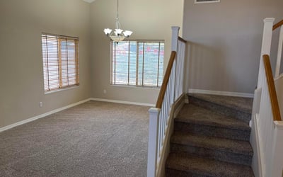 Make a lasting first impression with soaring ceilings, elegant staircase railings, oversized windows, and an open foyer that fills the home with natural light.