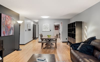 Spacious open-concept living area featuring modern decor and abundant natural light throughout.