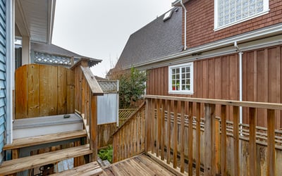 Discover a cozy outdoor space with wood decking, perfect for relaxation or private gatherings.