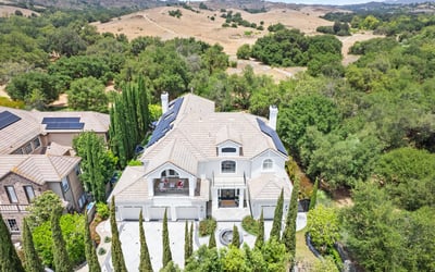 stunning views, surrounded by lush landscaping and open countryside.