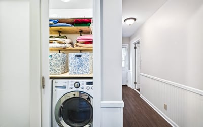 Efficient laundry closet with storage.