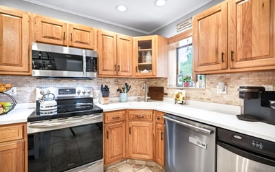 Efficient kitchen with SS appliances.