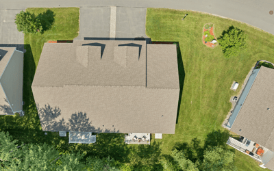 Spacious lot with well-maintained landscaping, featuring a welcoming outdoor space and convenient driveway access.
