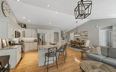 Bright open-concept living space featuring a modern kitchen, spacious dining area, and comfortable seating arrangements.