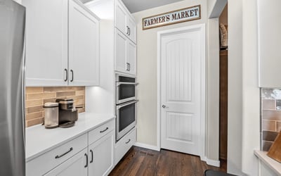 Coffee Bar in Kitchen that leads to pantry.