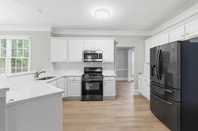 Bright and functional kitchen featuring modern appliances and open flow to living spaces for easy entertaining.