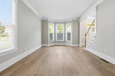 Bright and airy living space featuring large windows and flexible layout, perfect for customization and modern living.