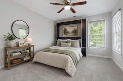 Bright and inviting bedroom featuring ample natural light, modern decor, and a versatile built-in murphy. (Virtual Staging)