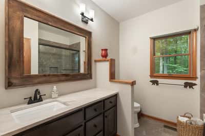 This inviting bathroom features a modern design with natural light and ample storage options.
