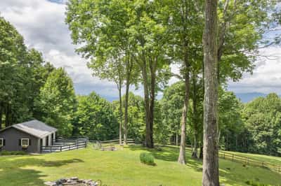 Secluded property with expansive greenery, offering breathtaking mountain views and a perfect outdoor retreat.