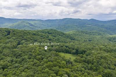 Discover a stunning wooded retreat perfect for building your dream home in nature’s embrace.