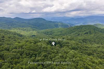 Secluded property on Flu Creek Drive, surrounded by lush forests and breathtaking mountain vistas. Perfect for nature lovers.