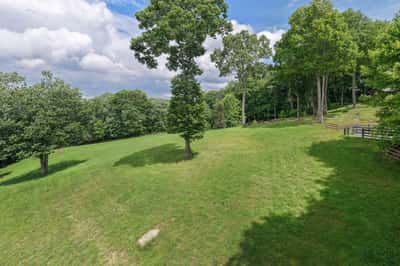 Spacious, sloping lot surrounded by trees, perfect for building your dream home in a natural setting.