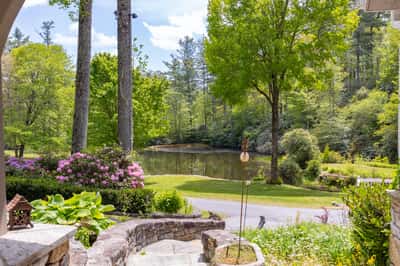 Breathtaking views of a tranquil pond surrounded by lush greenery, perfect for outdoor relaxation and enjoyment.