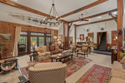 Spacious open-concept living area with rustic wood accents and a unique nautical theme throughout.