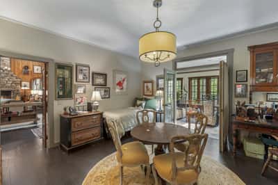 Cozy dining area with natural light, featuring vintage decor and easy access to the inviting living space.