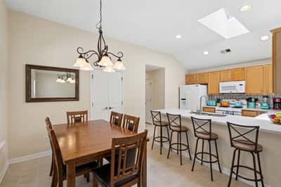 Open-concept kitchen and dining area (virtually staged)