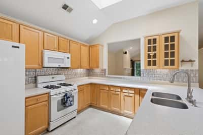 Kitchen with granite countertops and double sink