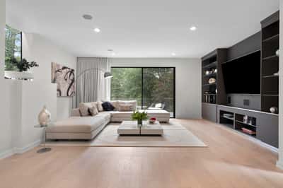 Spacious living area with ample natural light, featuring modern designs and a seamless indoor-outdoor connection.