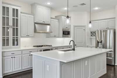 Kitchen with quartz countertops and large island