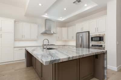 Island with Blue Moon Quartzite and breakfast bar seating