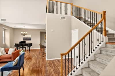 Spacious foyer welcomes you to a bright living area and an inviting staircase to the upper floors.