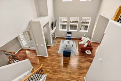Spacious living area with abundant natural light, showcasing modern design and an open floor plan.