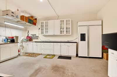 Spacious kitchen with ample cabinet storage and modern appliances, perfect for culinary enthusiasts and gatherings.