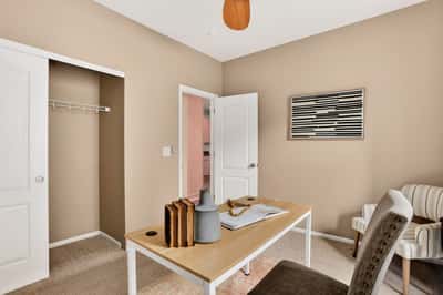 Bright and functional office space featuring built-in storage and a welcoming atmosphere for productivity.