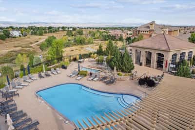 Discover this inviting property featuring a spacious outdoor pool area with stunning views of the surrounding landscape.