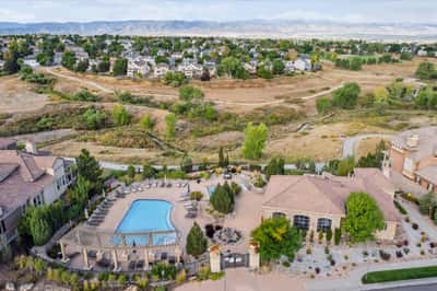 Nestled in nature, this community features a spacious pool surrounded by lush landscapes and scenic views.