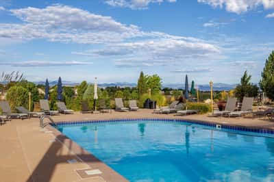 Enjoy stunning mountain views from this inviting pool area, perfect for relaxation and social gatherings.