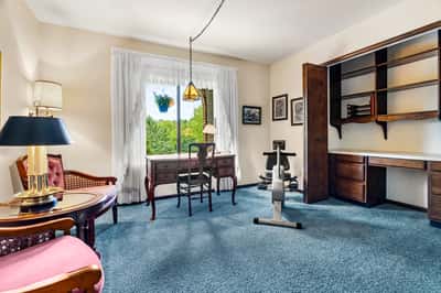 3rd bedroom with built in desk and shelves