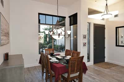 Bright dining space with large windows and updated lighting provides a stylish Scottsdale setting for hosting and daily dining.
