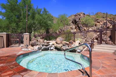 Outdoor spa surrounded by desert scenery offers a tranquil Scottsdale amenity perfect for relaxation and leisure.