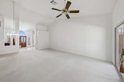 Open-concept living and dining spaces feature fresh paint, high ceilings, and bright interiors designed for comfortable Arizona living in Peoria.