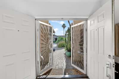 The welcoming foyer showcases abundant natural light and a bright, open feel from the moment you step inside. Thoughtful design elements create a seamless transition into the home's living spaces.