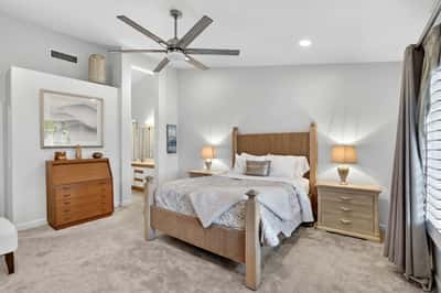 Designed for relaxation, this primary suite features ample square footage, natural light, and convenient access to the ensuite bath. A comfortable and private space to start and end each day.